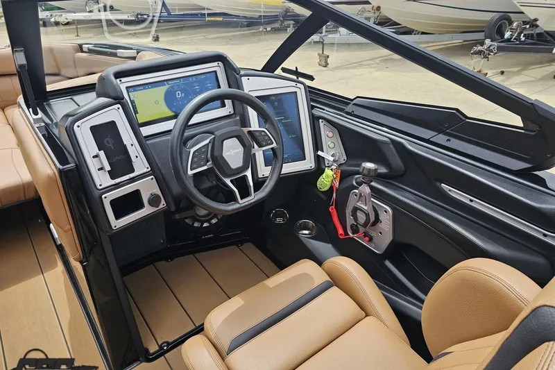 Slide: The Image of 2022 Supra SE 550 boat interior with modern dashboard and steering wheel. - 67