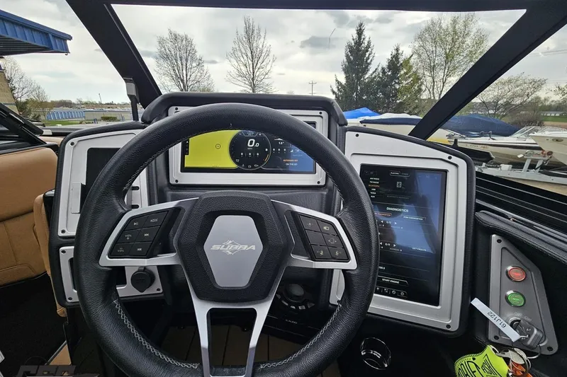 Slide: The Image of 2022 Supra SE 550 dashboard with steering wheel and digital displays. - 70