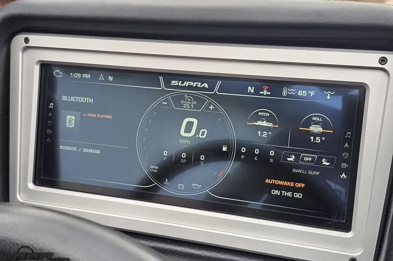 Slide: The Image of 2022 Supra SE 550 dashboard display showing speed, Bluetooth, and navigation features. - 72