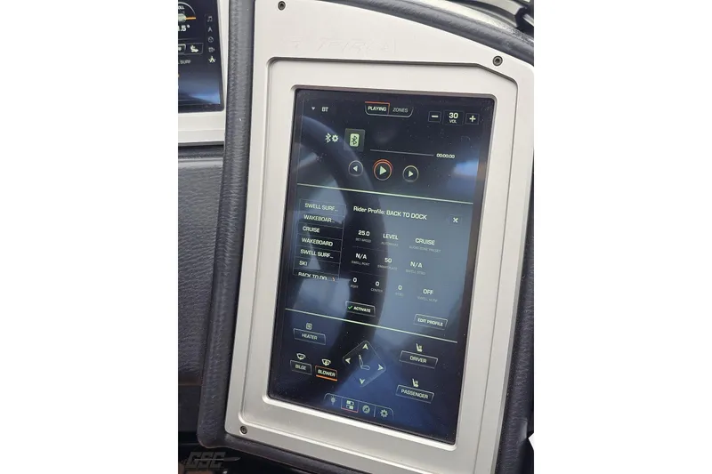 Slide: The Image of Touchscreen control panel in 2022 Supra SE 550 boat, displaying navigation and audio settings. - 73
