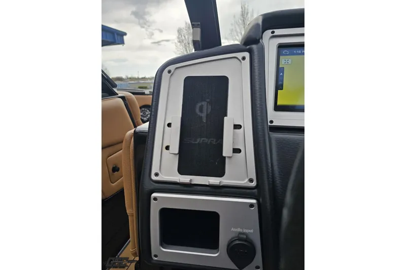 Slide: The Image of Interior of 2022 Supra SE 550 showing dashboard and control panel details. - 77