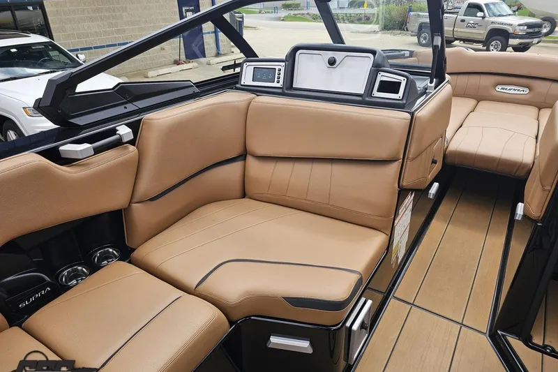 Slide: The Image of Luxurious interior of 2022 Supra SE 550 boat with tan leather seating. - 79