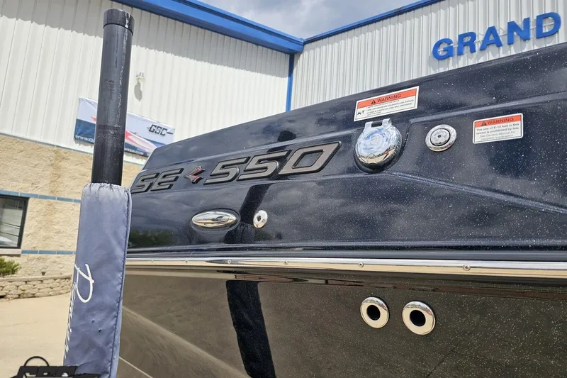 Slide: The Image of 2022 Supra SE 550 boat exterior at dealership, showcasing model details. - 8