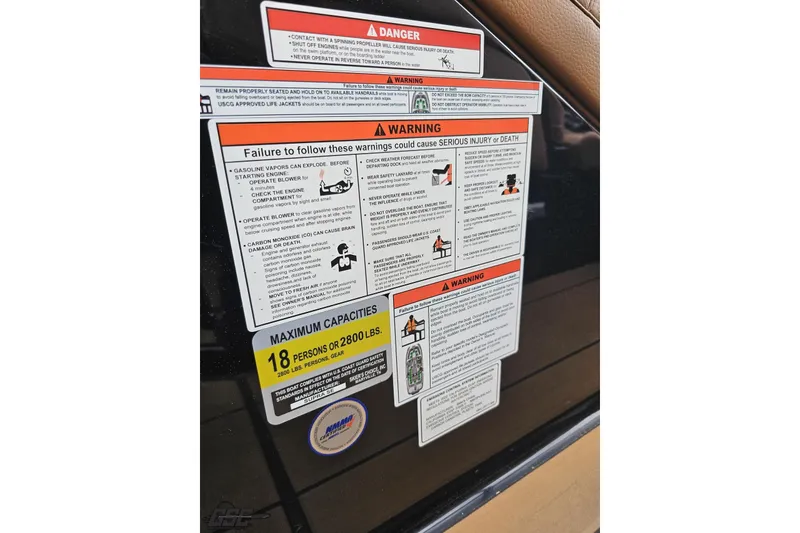 Slide: The Image of Safety warning labels on a 2022 Supra SE 550 boat, detailing maximum capacity and precautions. - 83