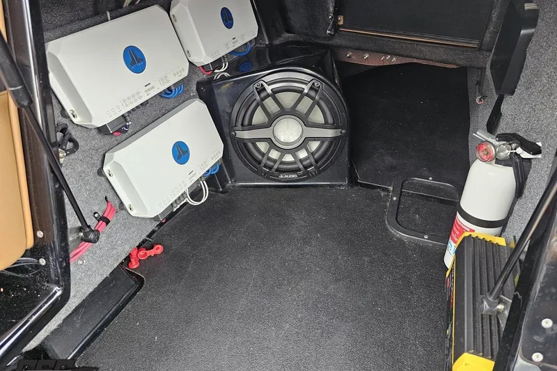 Slide: The Image of Audio system setup in a 2022 Supra SE 550 with amplifiers and subwoofer. - 86