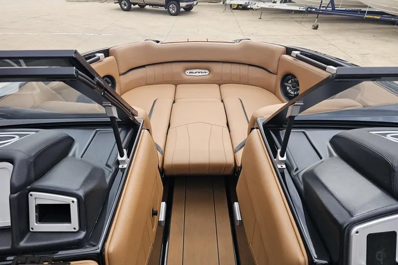 Slide: The Image of 2022 Supra SE 550 boat interior with tan leather seating and modern design. - 89
