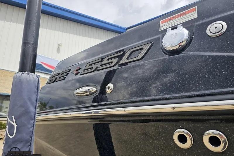 Slide: The Image of 2022 Supra SE 550 boat exterior with branding and fittings. - 9
