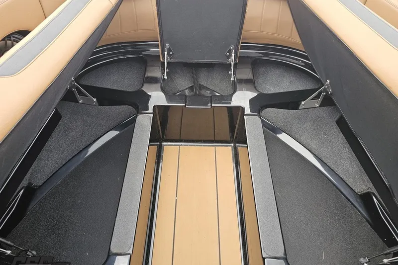 Slide: The Image of Interior view of 2022 Supra SE 550 boat, featuring spacious seating and storage compartments. - 93