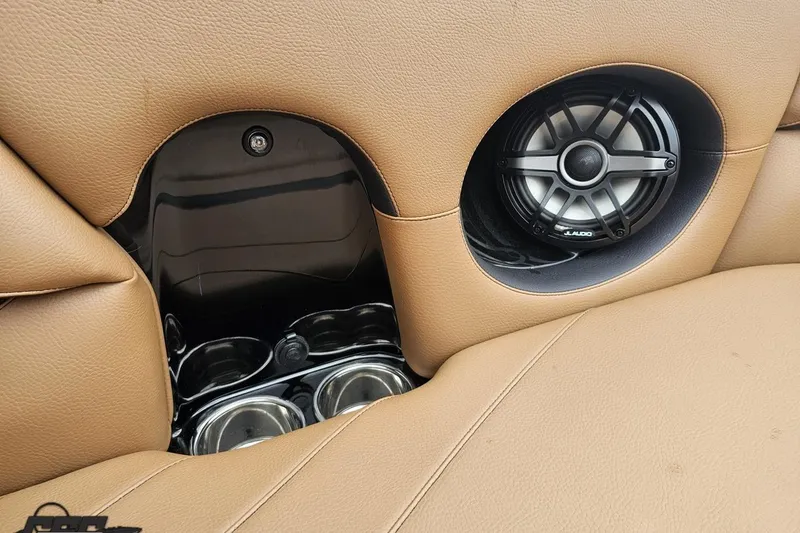 Slide: The Image of 2022 Supra SE 550 interior with JL Audio speaker and cup holders. - 95