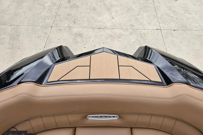 Slide: The Image of 2022 Supra SE 550 boat interior with tan upholstery and sleek design. - 96