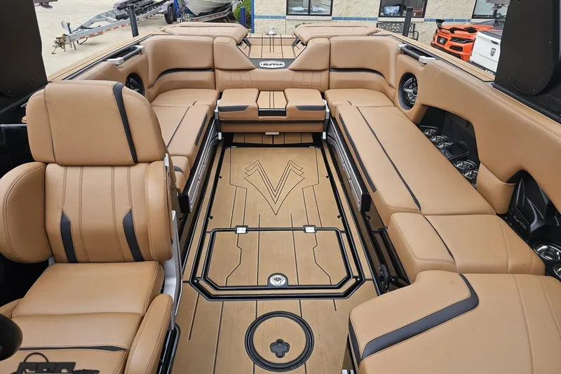 Slide: The Image of Luxurious interior of 2022 Supra SE 550 boat with tan leather seating. - 98