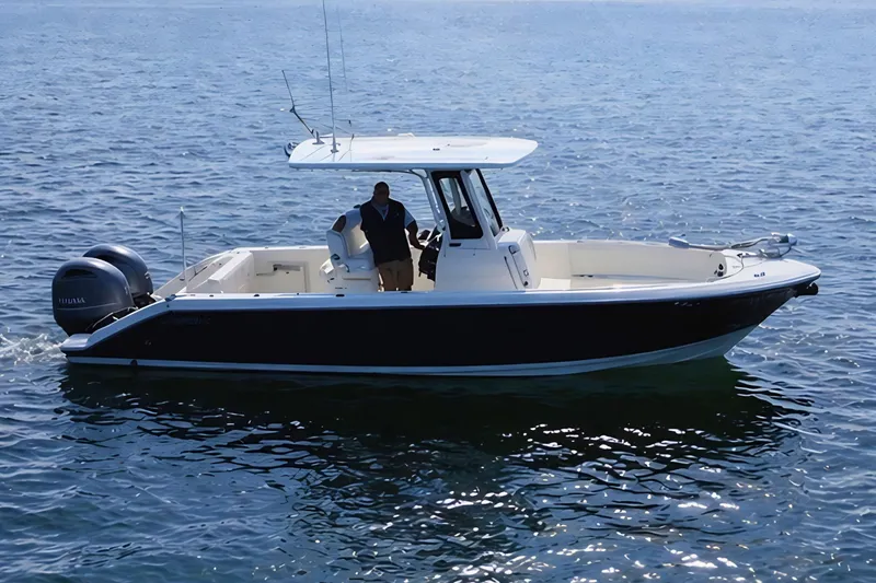 Slide: The Image of 2021 Pursuit S 268 Sport boat cruising on open water. - 3