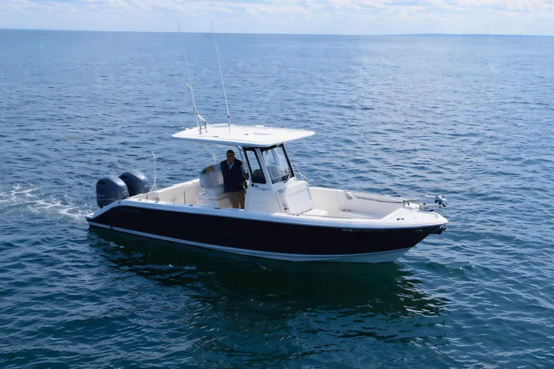 Slide: The Image of 2021 Pursuit S 268 Sport boat cruising on open water. - 4