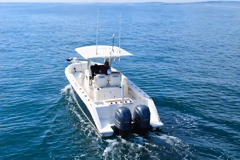 Slide: The Image of 2021 Pursuit S 268 Sport boat cruising on open blue water. - 5