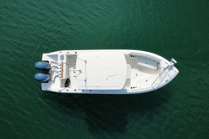 Slide: The Image of Aerial view of 2021 Pursuit S 268 Sport boat on calm water. - 7