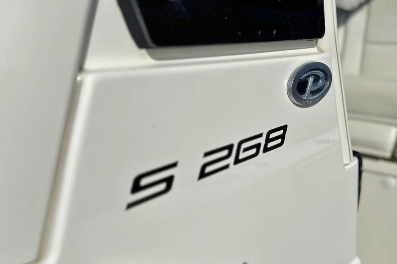Slide: The Image of 2021 Pursuit S 268 Sport boat emblem and model detail. - 8