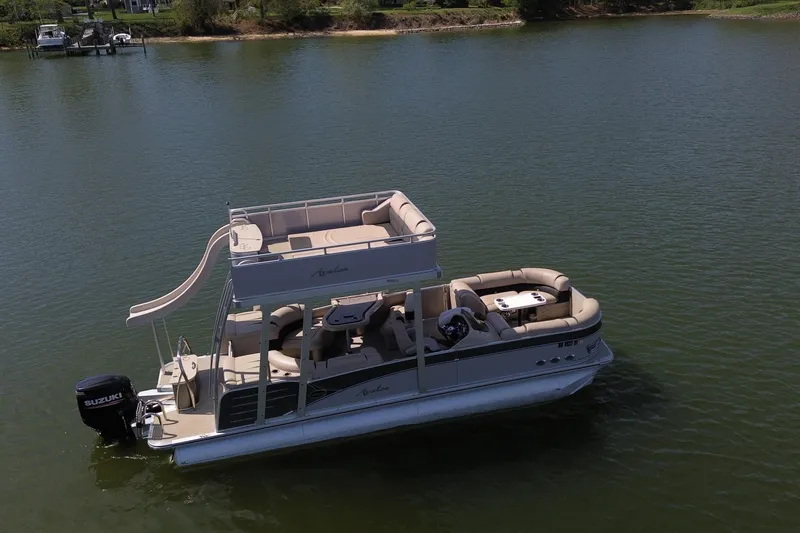 Slide: The Image of 2018 Avalon Catalina Funship Platinum pontoon boat with slide on a calm lake. - 10