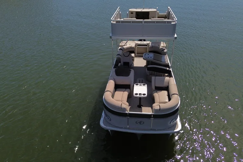 Slide: The Image of 2018 Avalon Catalina Funship Platinum pontoon boat on calm water, aerial view. - 11