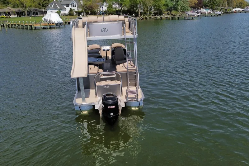 Slide: The Image of 2018 Avalon Catalina Funship Platinum pontoon boat with slide on a serene lake. - 12