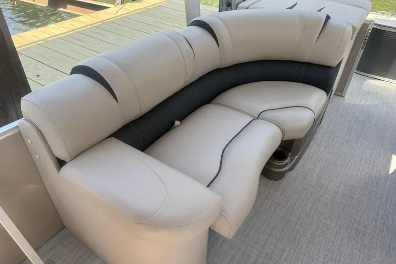 Slide: The Image of Luxurious seating on 2018 Avalon Catalina Funship Platinum boat, featuring plush beige upholstery. - 16