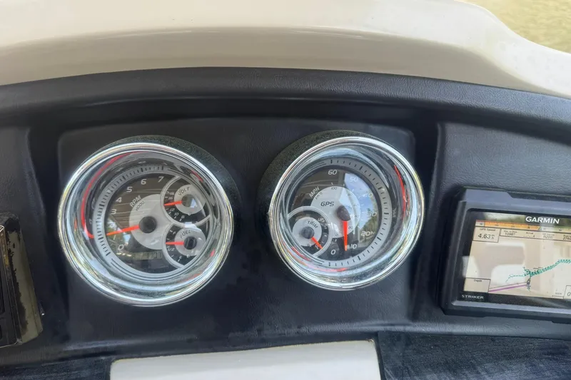 Slide: The Image of Dashboard of 2018 Avalon Catalina Funship Platinum with gauges and Garmin GPS display. - 20
