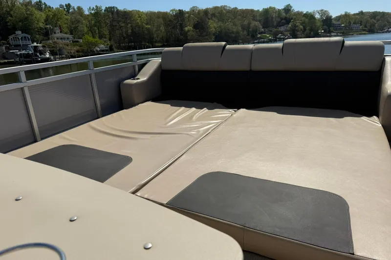 Slide: The Image of 2018 Avalon Catalina Funship Platinum boat interior with spacious seating and scenic lake view. - 25