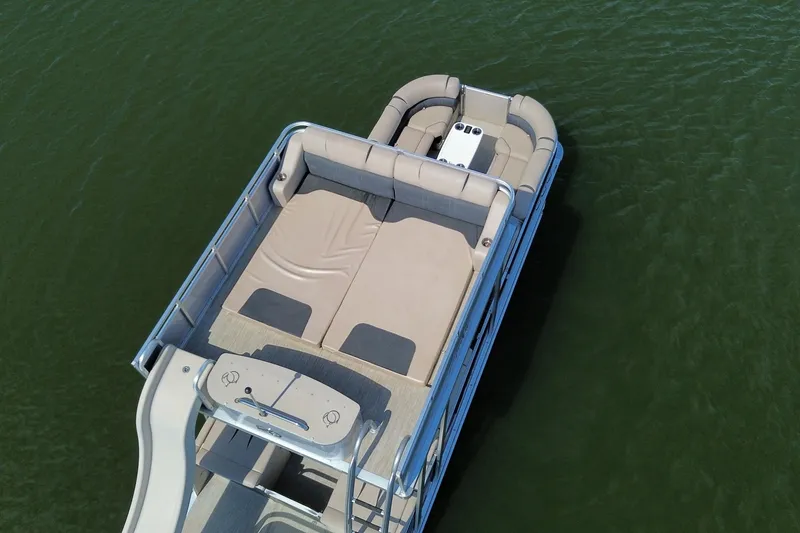 Slide: The Image of 2018 Avalon Catalina Funship Platinum pontoon boat on calm water, aerial view. - 3