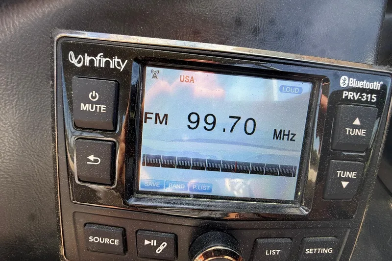 Slide: The Image of Infinity Bluetooth radio display on 2018 Avalon Catalina Funship Platinum, tuned to FM 99.70 MHz. - 30