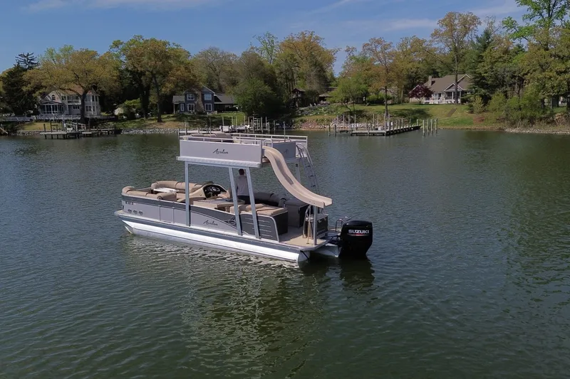 Slide: The Image of 2018 Avalon Catalina Funship Platinum pontoon boat with slide on a serene lake. - 5