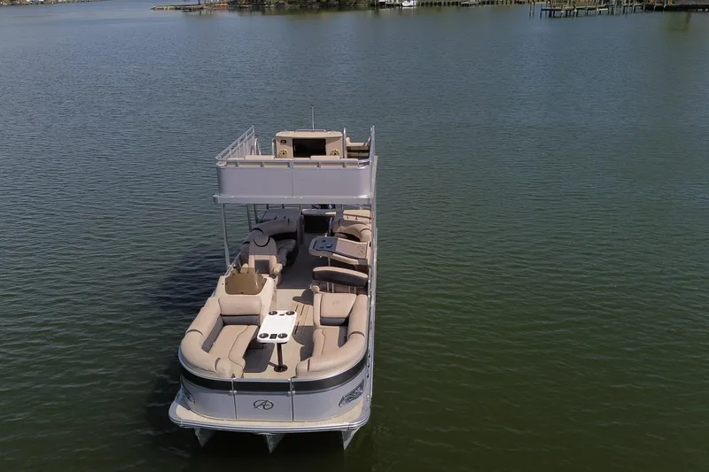 Slide: The Image of 2018 Avalon Catalina Funship Platinum pontoon boat on calm water. - 8
