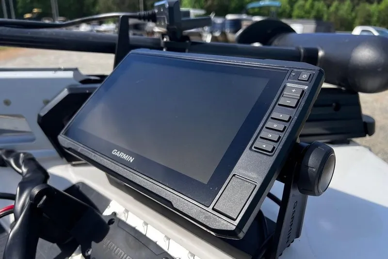 Slide: The Image of Garmin GPS device mounted on a 1999 Skeeter SX170 boat dashboard. - 11