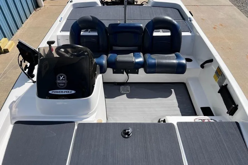 Slide: The Image of 1999 Skeeter SX170 boat interior with blue seats and Power-Pole equipment. - 14