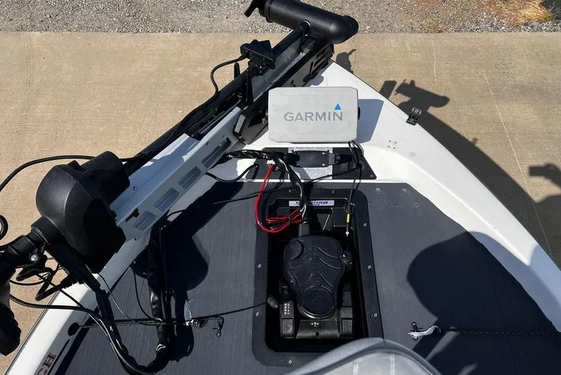 Slide: The Image of 1999 Skeeter SX170 boat with Garmin navigation system and trolling motor on deck. - 4