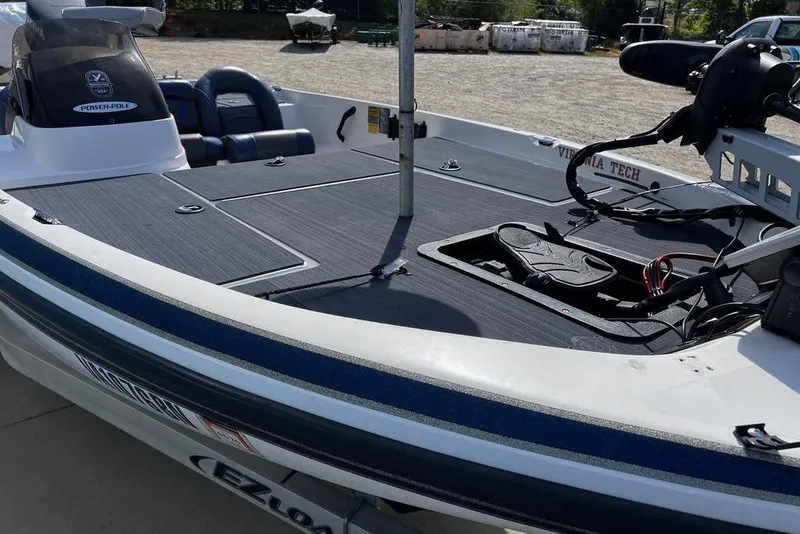 Slide: The Image of 1999 Skeeter SX170 boat deck with fishing equipment and seating. - 5