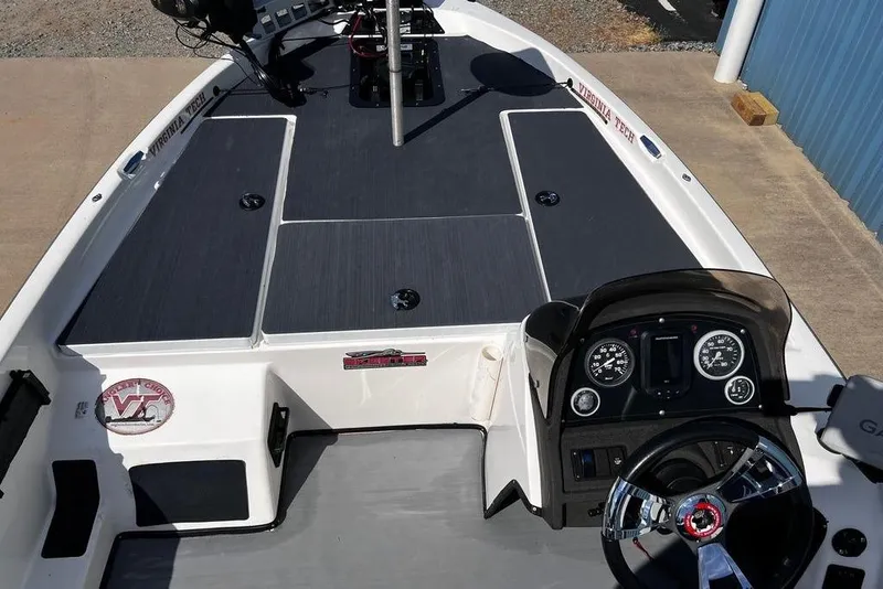 Slide: The Image of 1999 Skeeter SX170 boat interior with steering wheel and dashboard controls. - 8