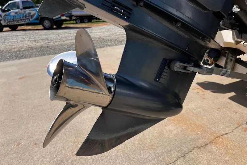 Slide: The Image of 1999 Skeeter SX170 boat propeller, shiny metal finish, on concrete surface. - 9