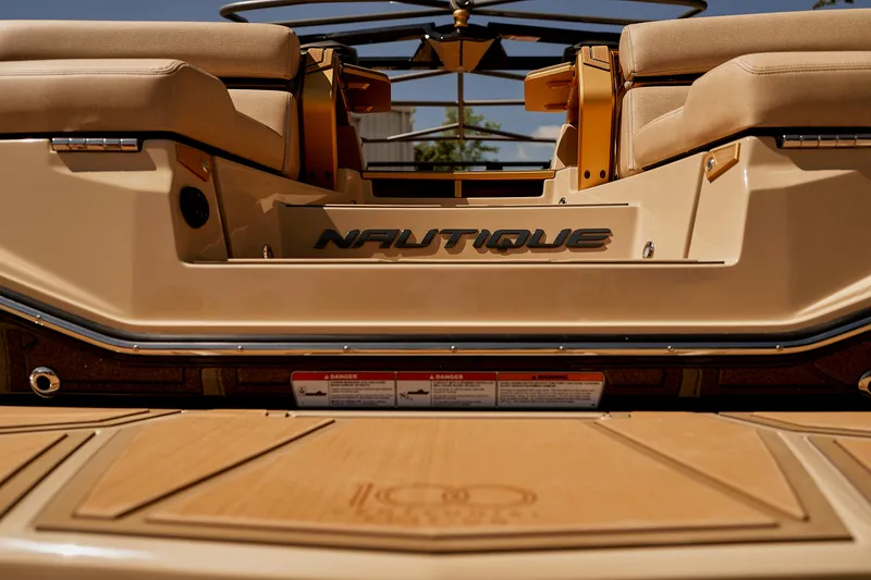 Slide: The Image of 2025 Nautique Super Air Nautique G25 Paragon boat interior, featuring luxurious seating and sleek design. - 21