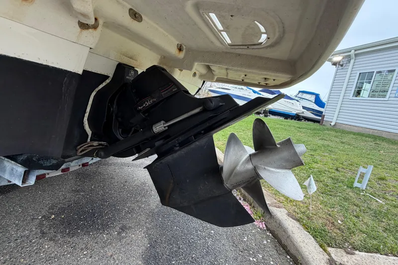 Slide: The Image of Rear view of a 2009 Sea Ray 210 Sundeck boat propeller and outdrive. - 27