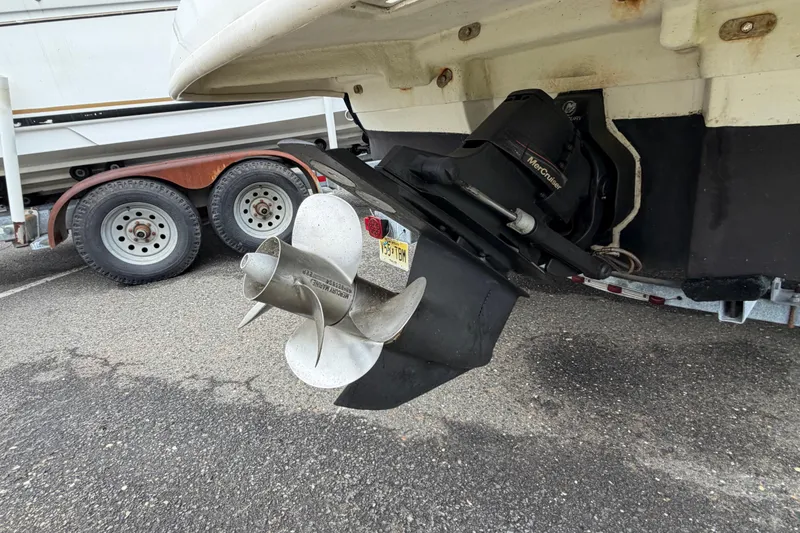 Slide: The Image of Rear view of a 2009 Sea Ray 210 Sundeck boat with propeller and trailer. - 28