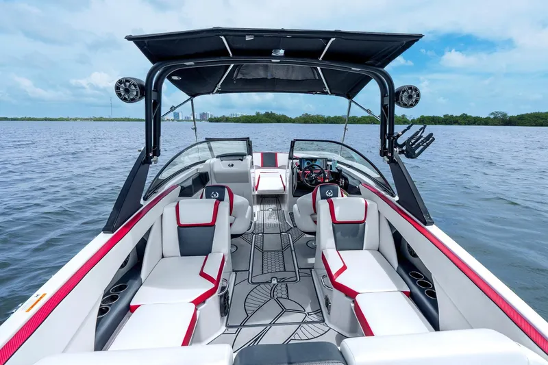 Slide: The Image of 2017 Scarab 255 H.O. Impulse boat interior with stylish seating on a calm lake. - 12