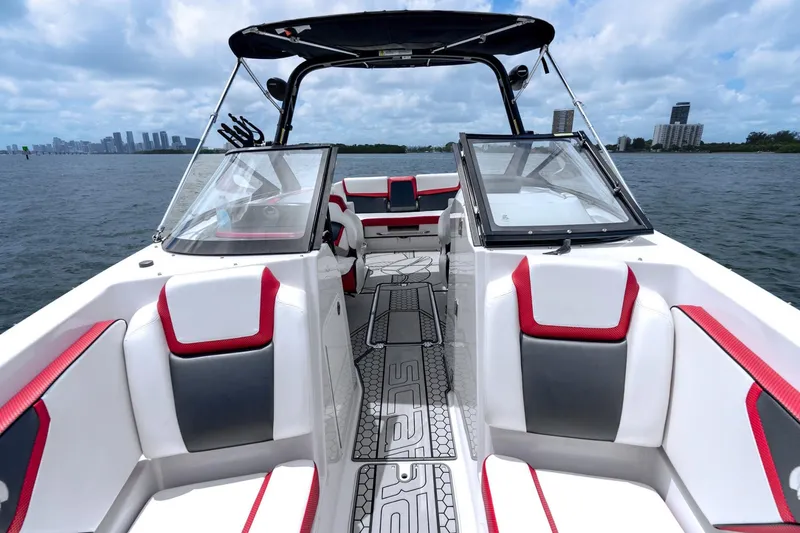 Slide: The Image of 2017 Scarab 255 H.O. Impulse boat interior with red and white seating on open water. - 14