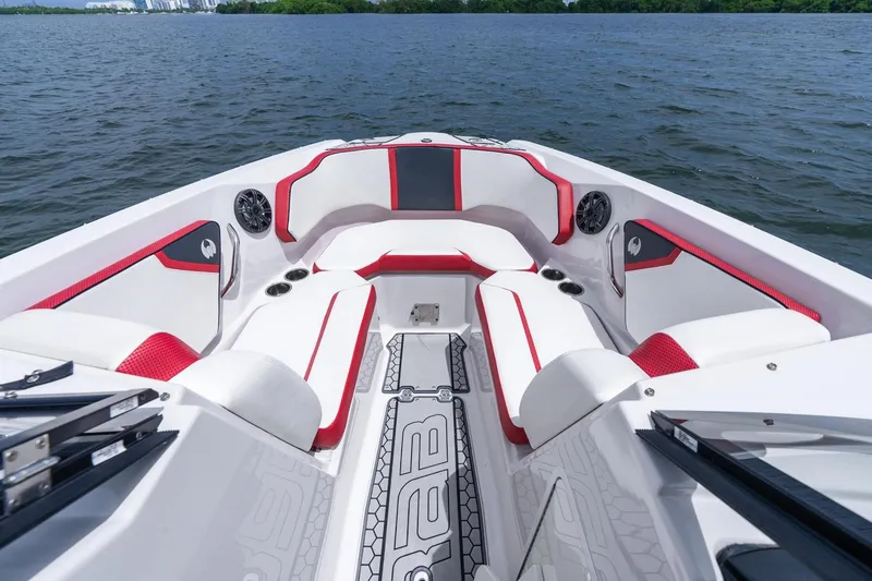 Slide: The Image of 2017 Scarab 255 H.O. Impulse boat interior with red and white seating on water. - 15