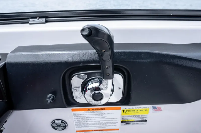 Slide: The Image of Throttle control of 2017 Scarab 255 H.O. Impulse boat, featuring warning labels. - 23