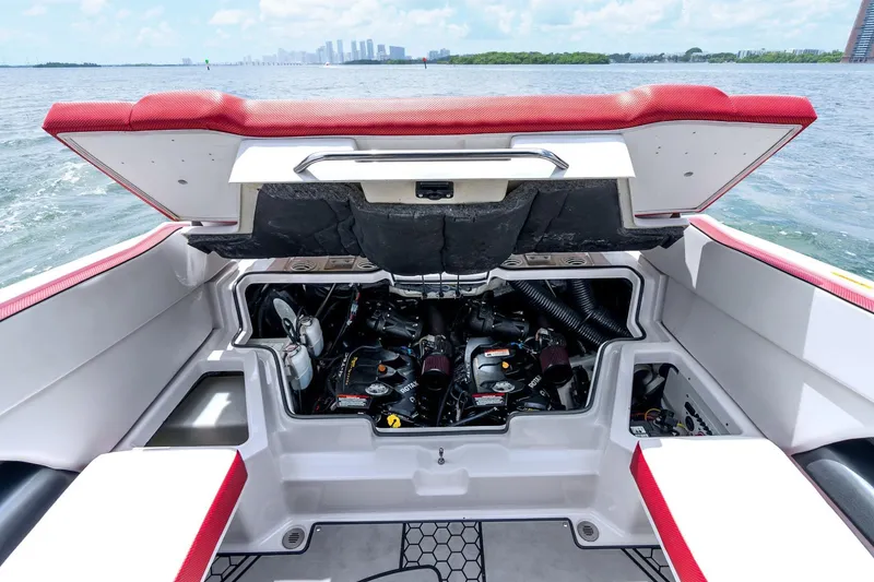 Slide: The Image of 2017 Scarab 255 H.O. Impulse boat engine compartment with open hatch, on water. - 24