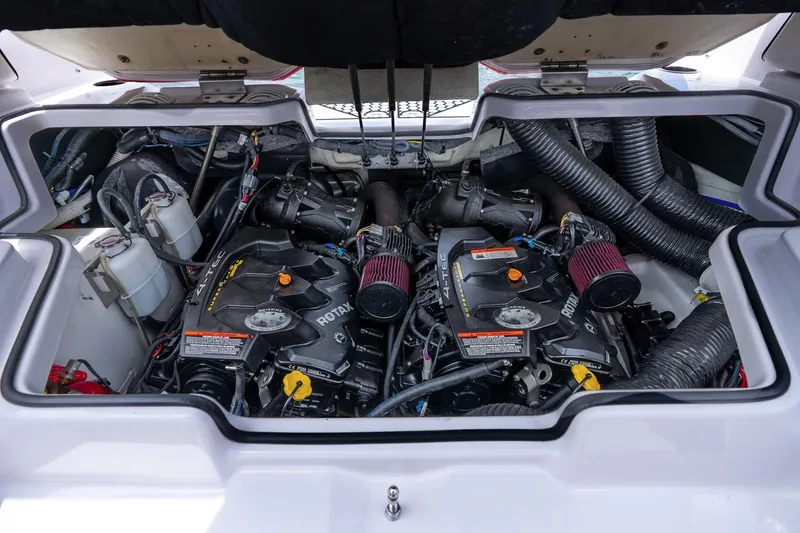 Slide: The Image of Engine compartment of a 2017 Scarab 255 H.O. Impulse boat, showcasing dual Rotax engines. - 25