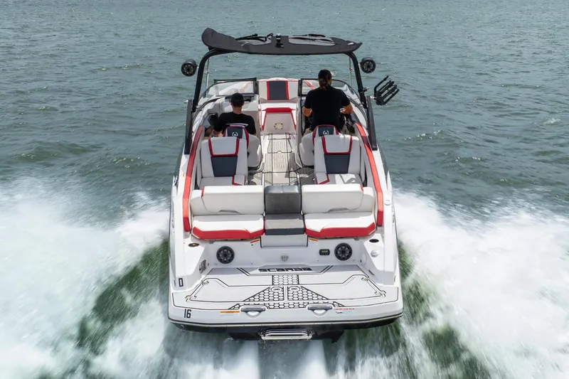 Slide: The Image of 2017 Scarab 255 H.O. Impulse boat cruising on open water, rear view. - 3