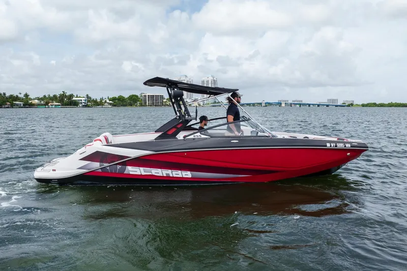 Slide: The Image of 2017 Scarab 255 H.O. Impulse boat cruising on a scenic waterway. - 34