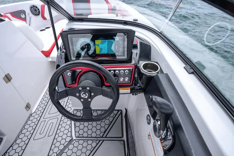 Slide: The Image of Cockpit of 2017 Scarab 255 H.O. Impulse boat with steering wheel and control panel. - 7