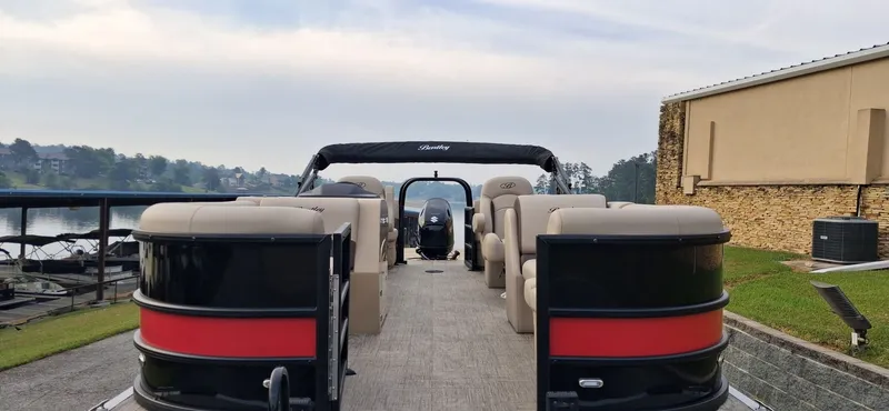 Slide: The Image of 2026 Bentley Pontoons Legacy 220 Navigator on a serene lake. - 5