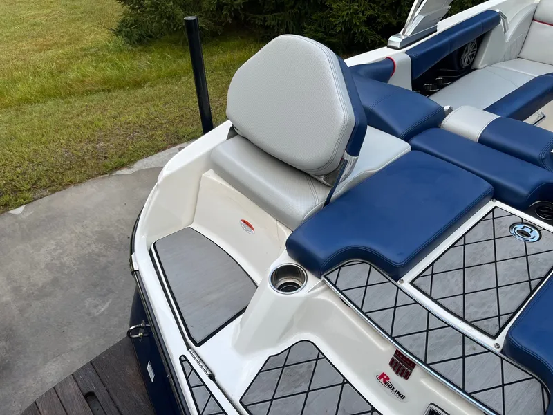 Slide: The Image of 2015 MasterCraft X20 boat with blue and white seating. - 21